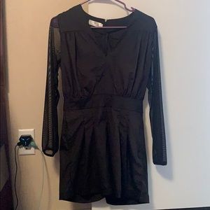 black romper with sheer sleeves and pockets